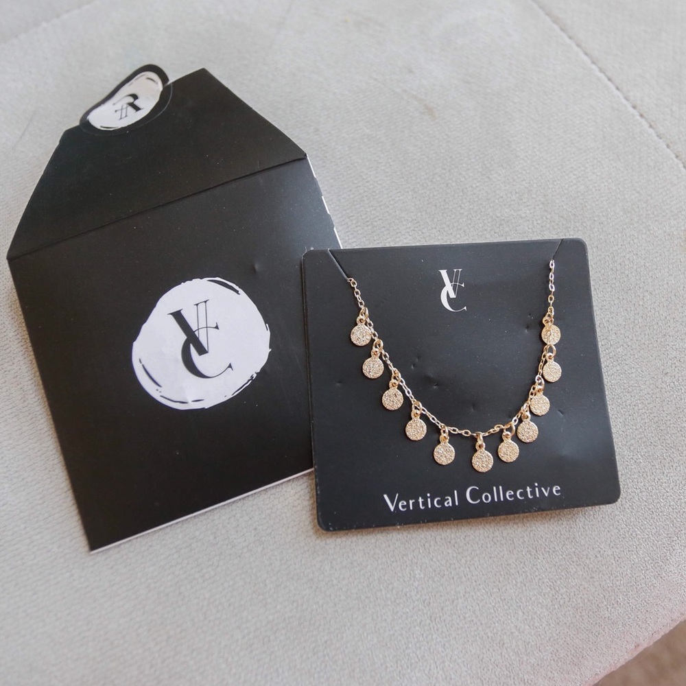 Gold coin bracelet by Vertical Collective